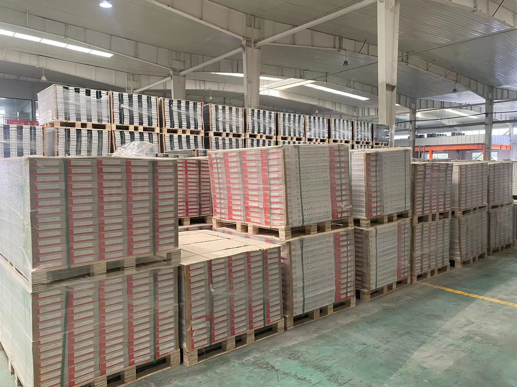 Palletized finished SPC flooring stored in the factory